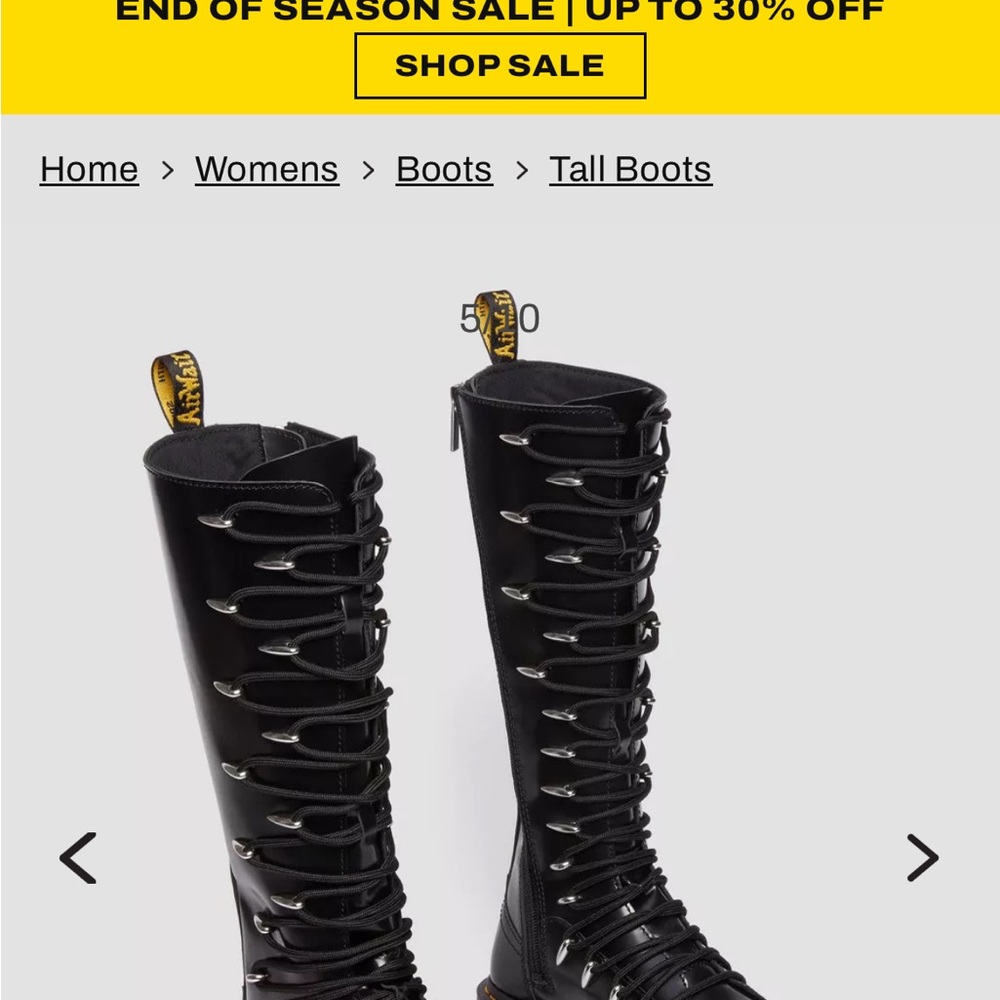 Dr. Martens Black Combat Boots with Intricate Lacing and Sturdy Sole